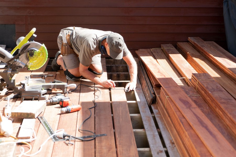 man measuring the deck in hamilton (1)